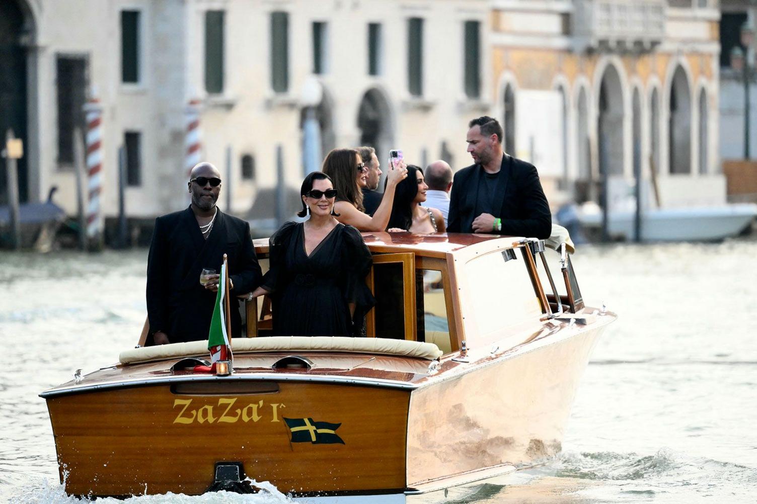 US manager Corey Gamble and US television personality Kris Jenner in Venice, Italy, for the wedding of Jeff Bezos and Lauren Sanchez. They are both wearing black outfits and sunglasses.