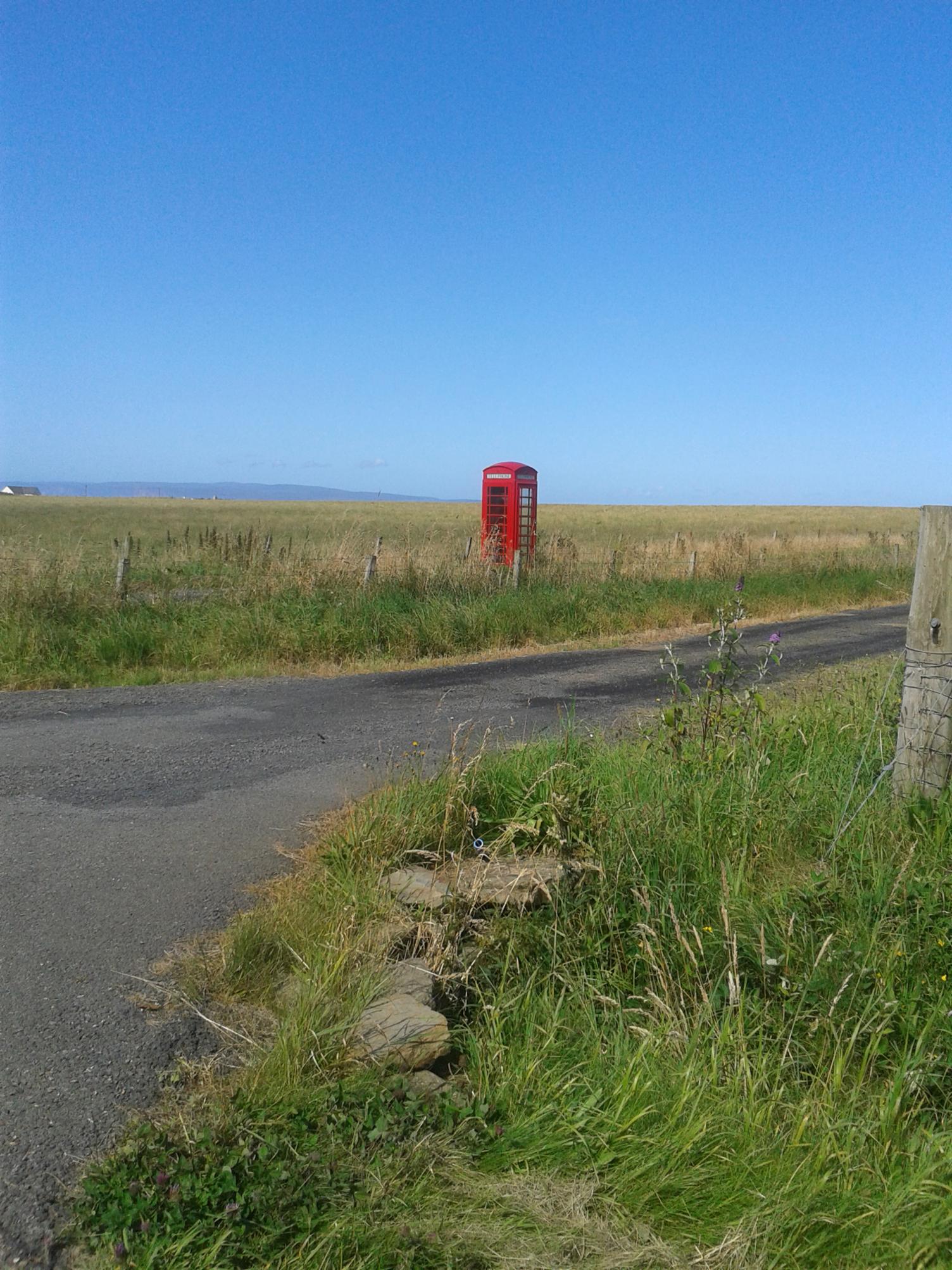 Phone box in a field