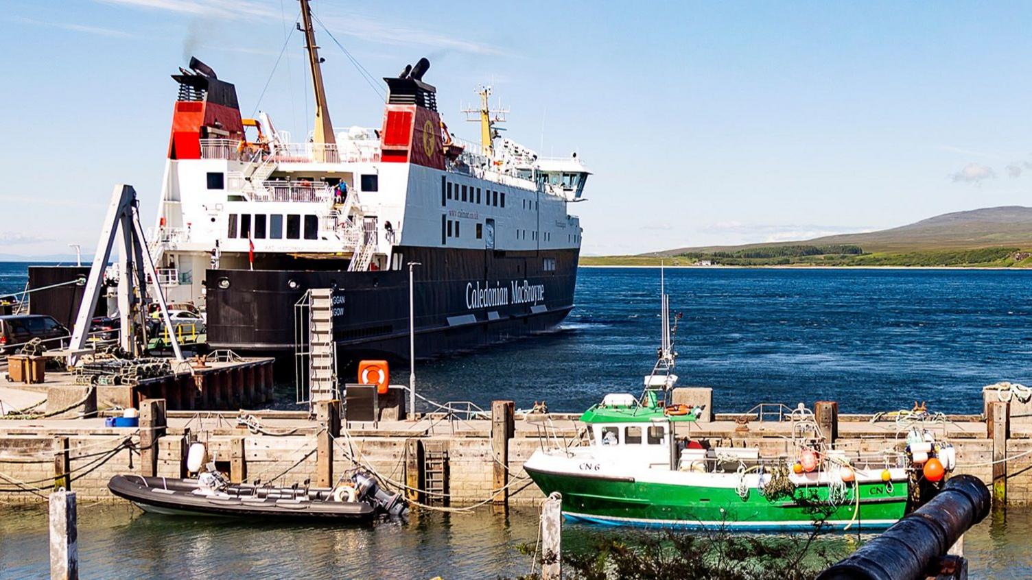 ferry and small boats at dock