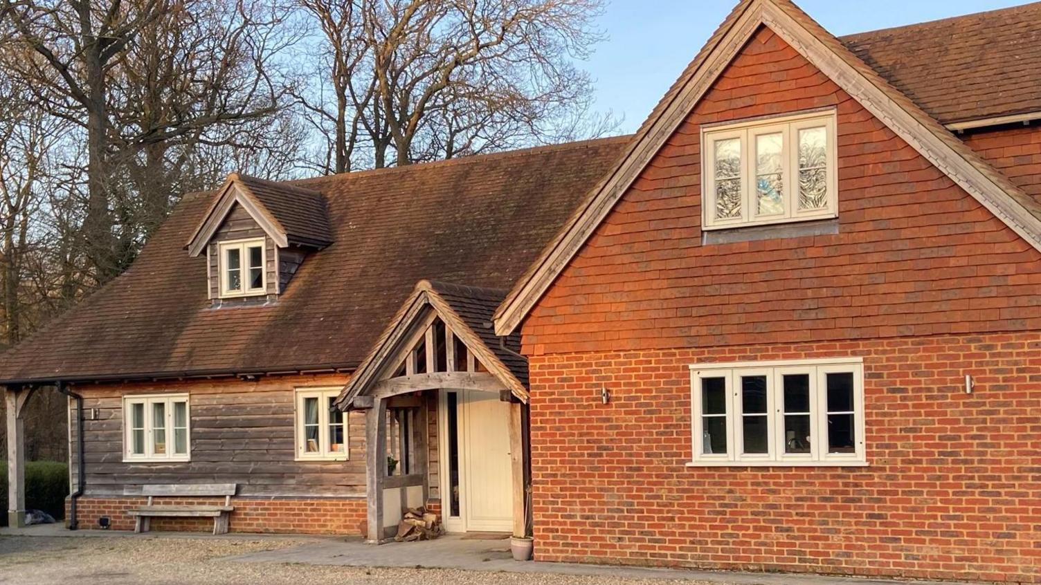 A brown house with a white front door