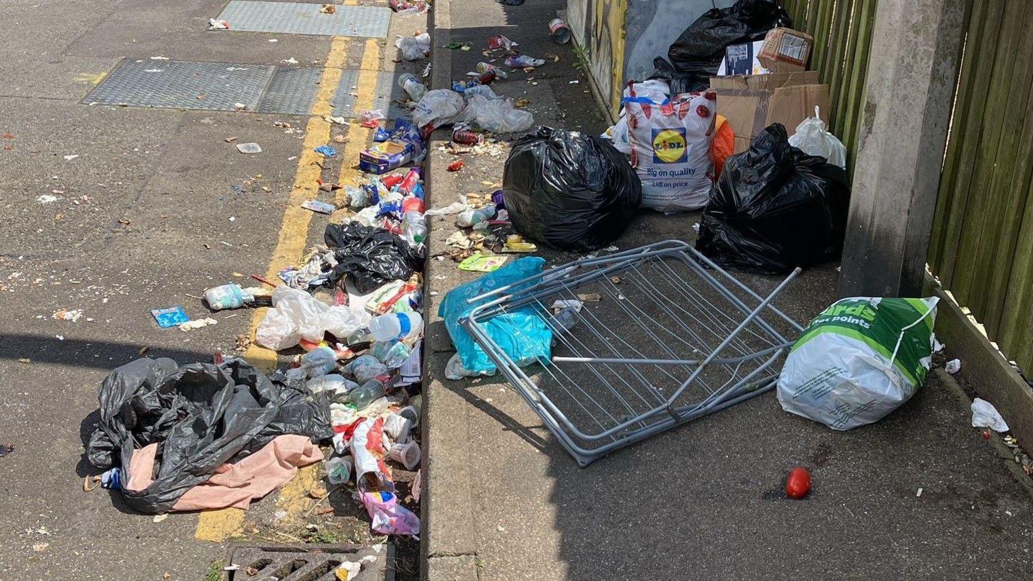 discarded rubbish and laundry rack