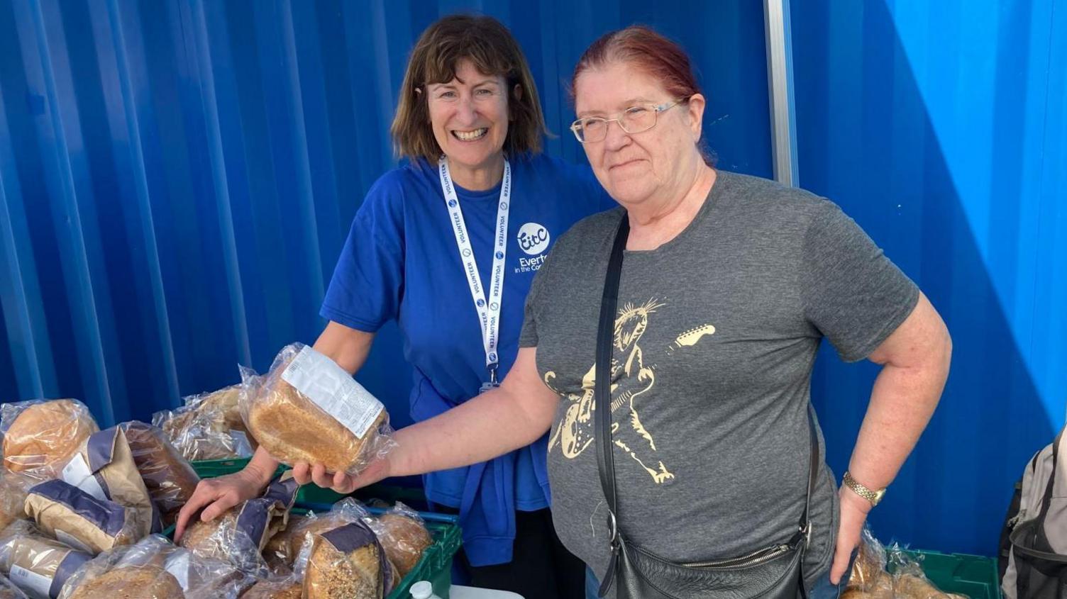 Gill Dolan (L) with pantry customer Barbara Turney