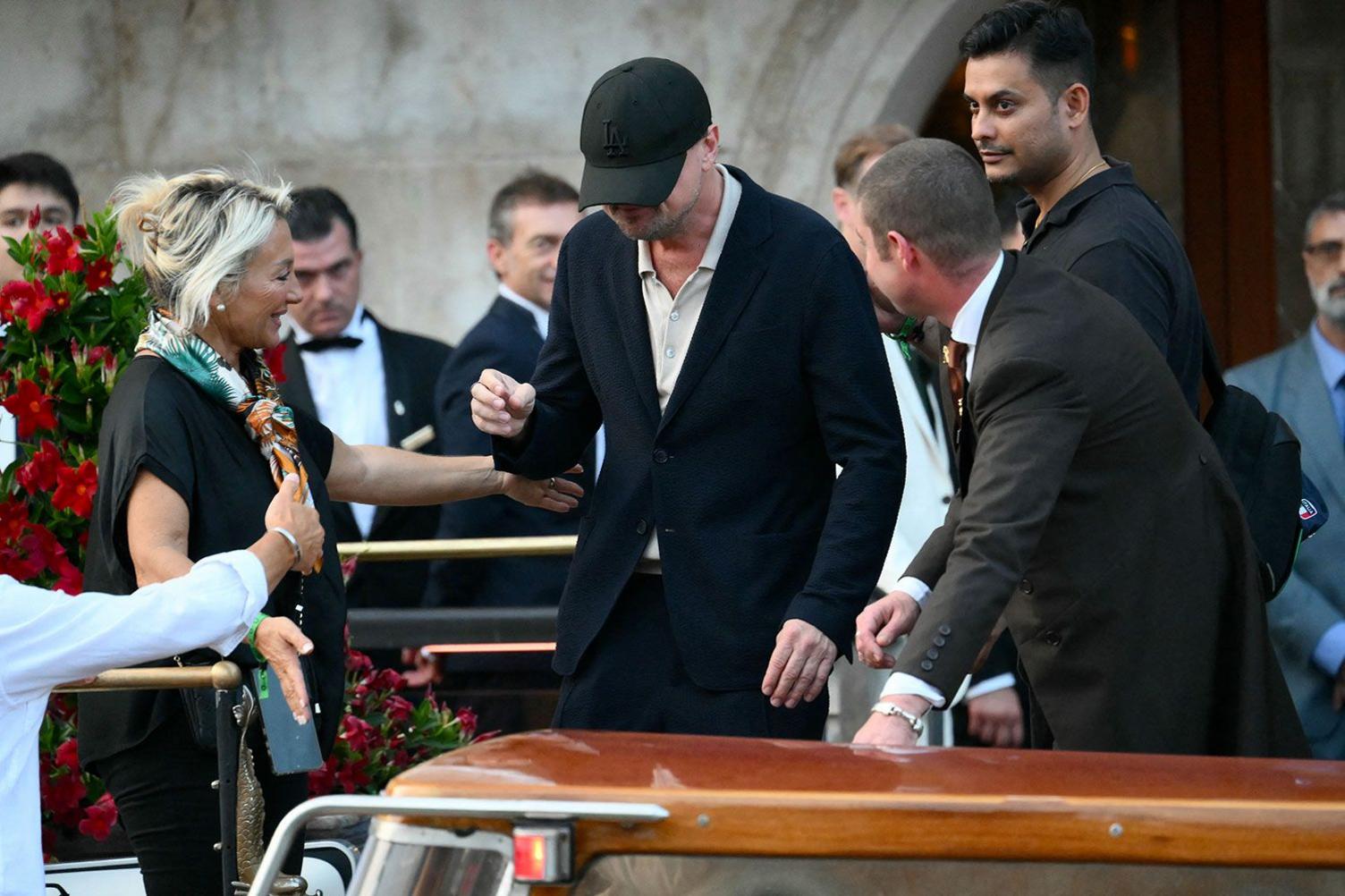 US actor Leonardo Dicaprio in Venice, Italy, for the wedding of Jeff Bezos and Lauren Sanchez. He is wearing a dark baseball cap which is partially obscuring his face.