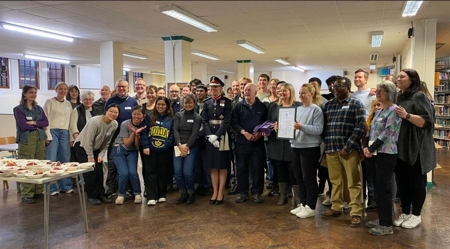 Volunteers from Sheffield's Sunday Centre, which has been cooking hot meals for people in need every Sunday, awarded the Kings Award for Voluntary Service by Dame Hilary Chapman, Lord Lieutenant of South Yorkshire (front).