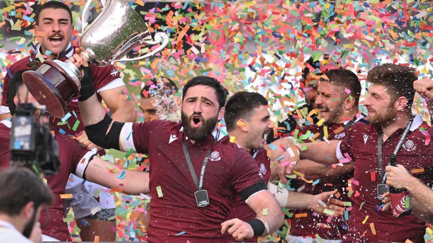 Georgia players celebrate with the Rugby Europe Championship trophy