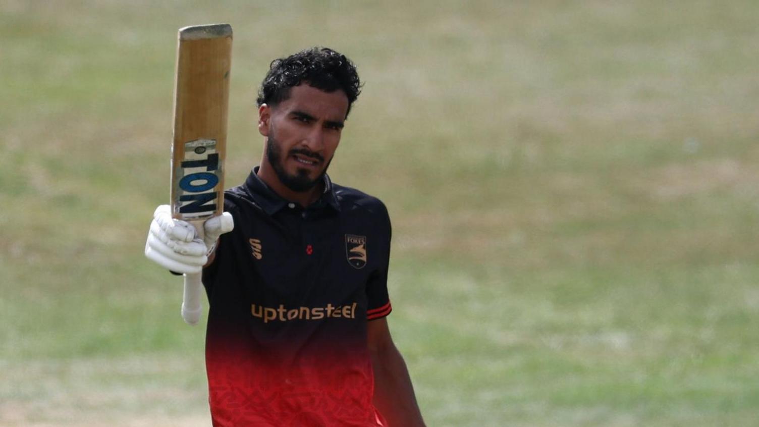 Hamza Shaikh holds his bat up for Leicestershire after scoring a century against Notts Outlaw in the One-Day Cup semi-final