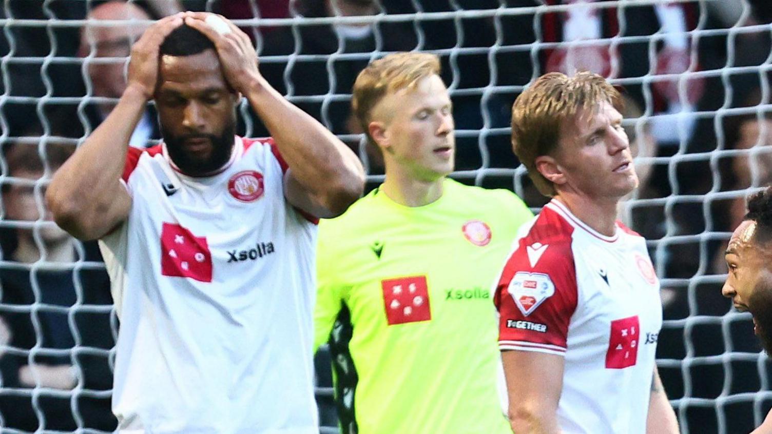 Dejected-looking Stevenage players