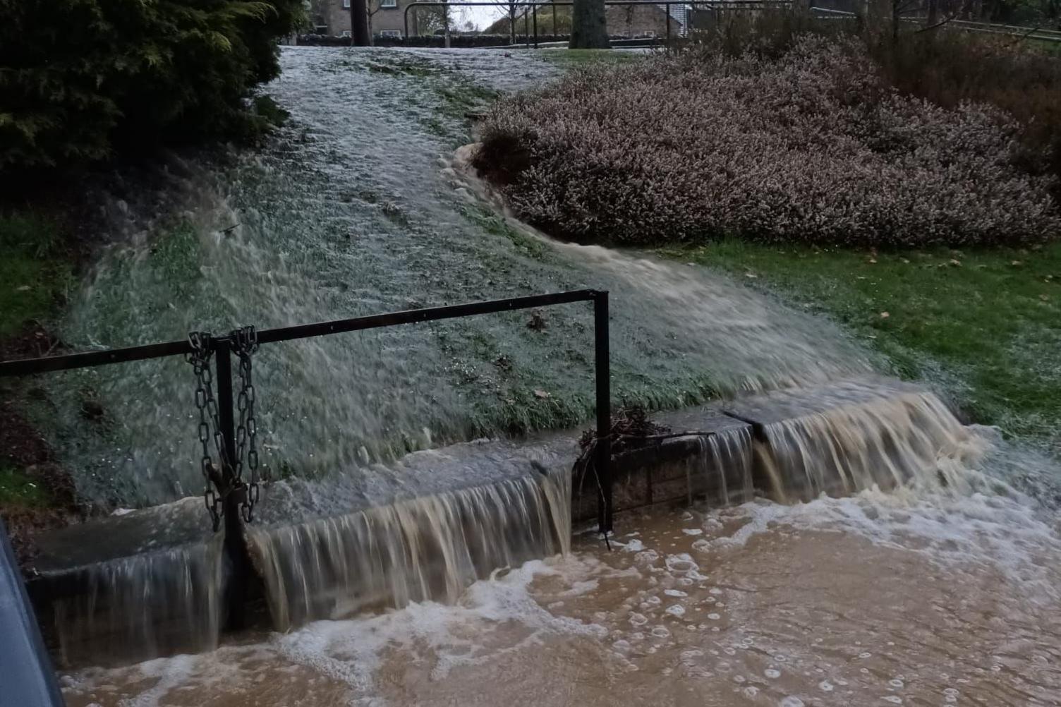 Floodwater pouting down a slope