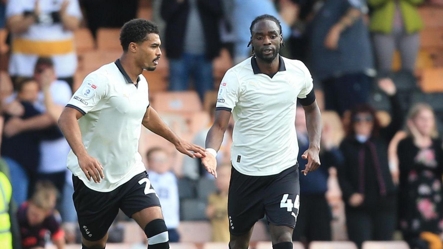 Devante Cole (right) celebrates his debut goal for Port Vale