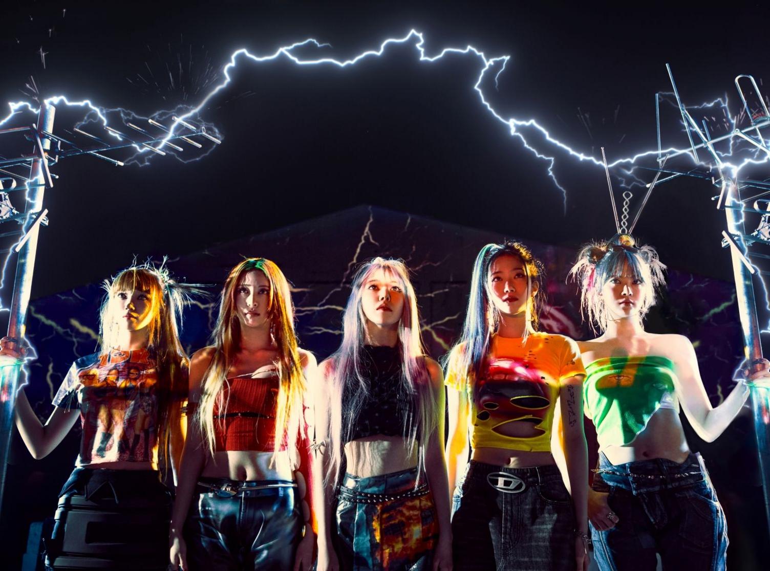 Le Sserafim are surrounded by bolts of lightning and sparks of electricity in a promotional photo supplied by their record label