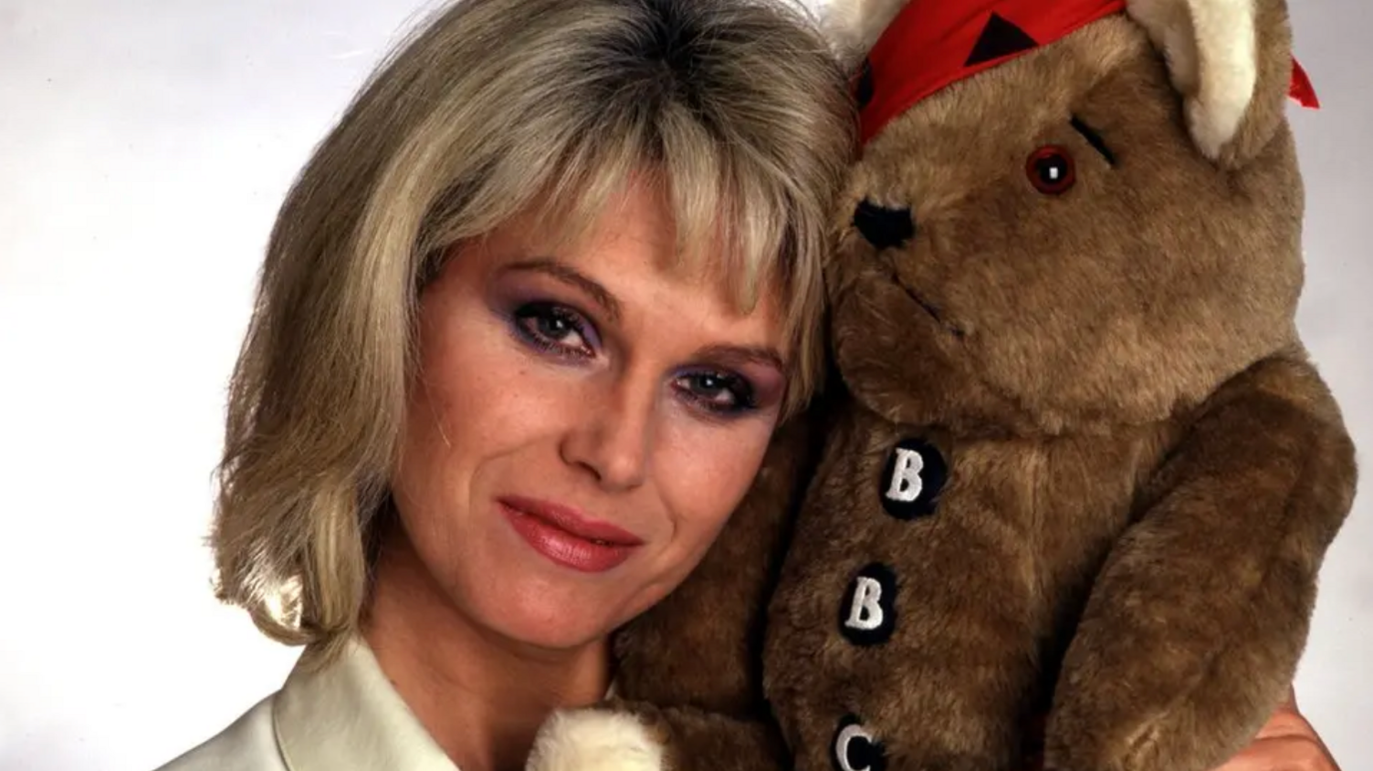 Joanna Lumley holds one of the original Pudsey Bears