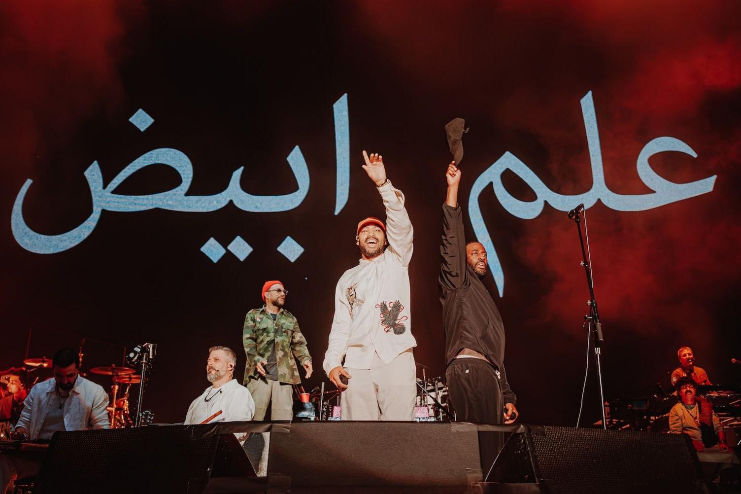 Bashy and Kano on stage with Gorillaz