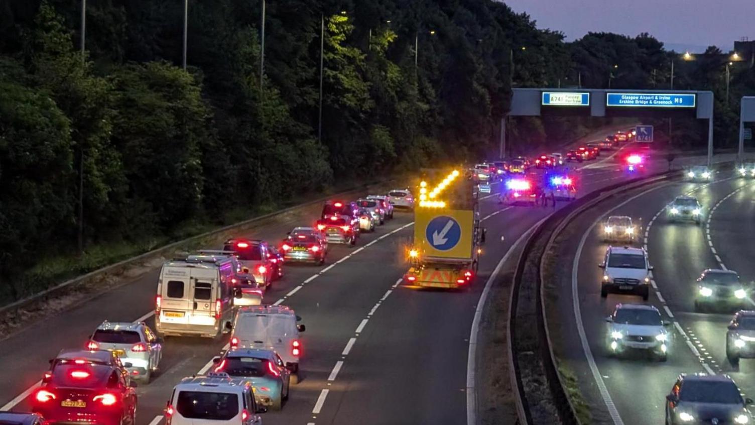 Two women taken to hospital after car crashes off bridge onto M8 - BBC News