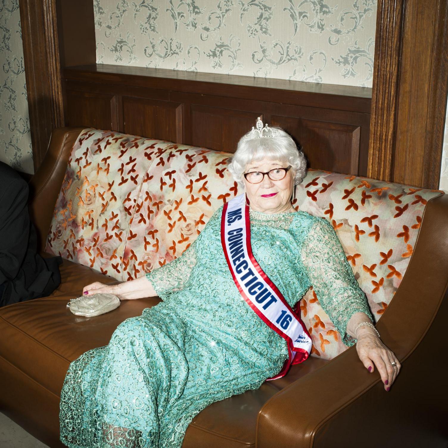 In a mint green dress, rhinestone earrings and tiara at the 2016 Ms Senior America pageant