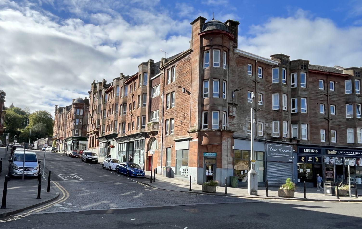 A view of John Wood Street, an old street of red sandstone buildings, showing it largely devoid of people