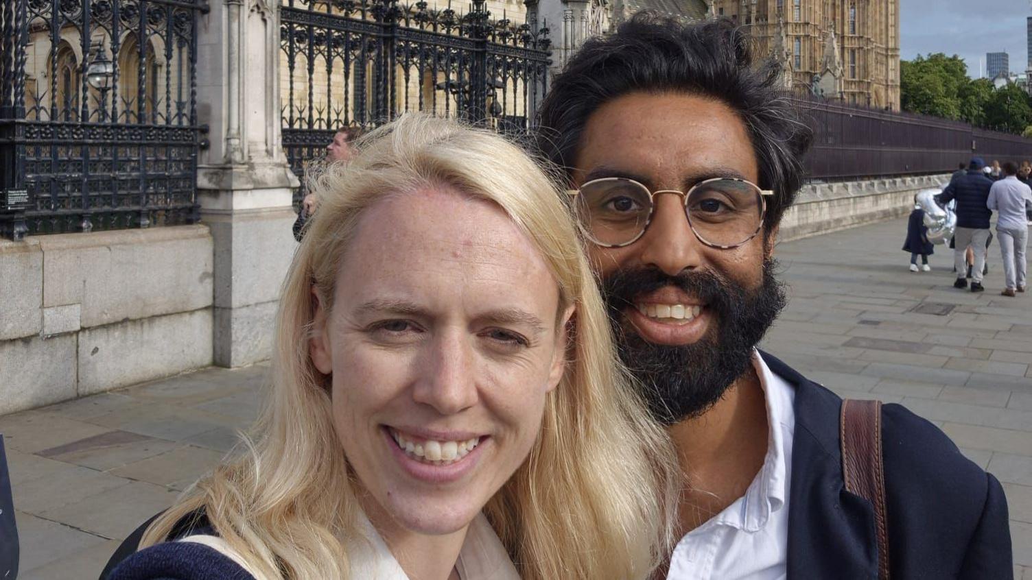 A smiling Louise Jones takes a selfie cuddling her new fiance Jeevun Sandher as they stand outside the Houses of Parliament 