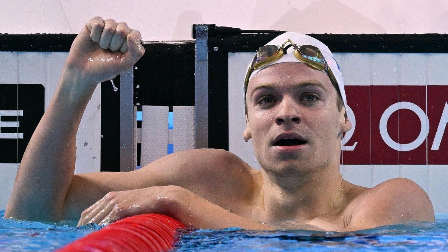 France's Leon Marchand celebrates winning gold at the World Aquatics Championships in Singapore.