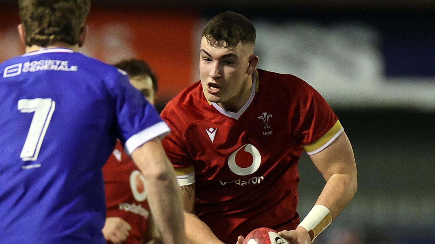 Luke Evans carries the ball for Wales Under-20s against France