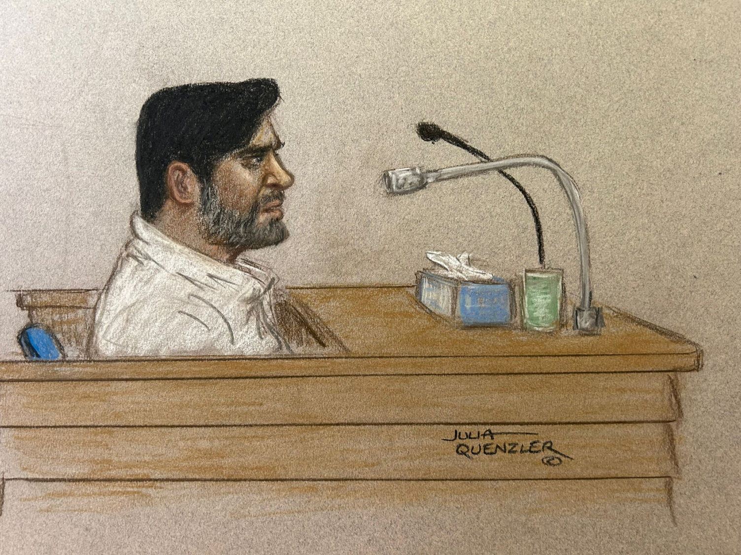 A court drawing of Urfan Sharif at the Old Bailey. It shows a side view of him. He is sat in a dock and is talking into a microphone