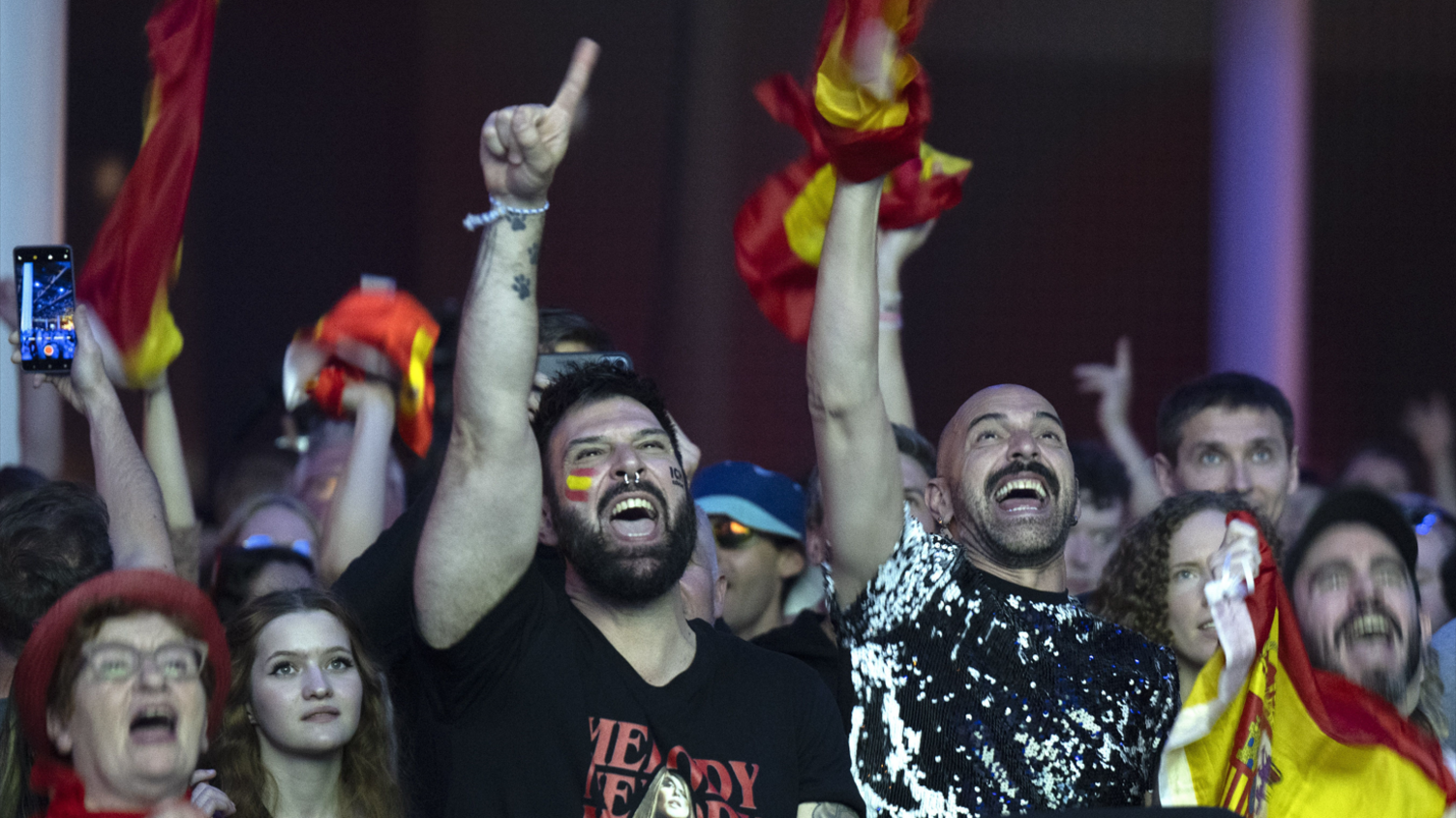 Supporters of Spain watch a broadcast in the Eurovision Village