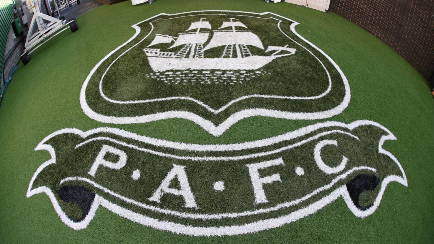 Plymouth Argyle logo emblazoned on turf