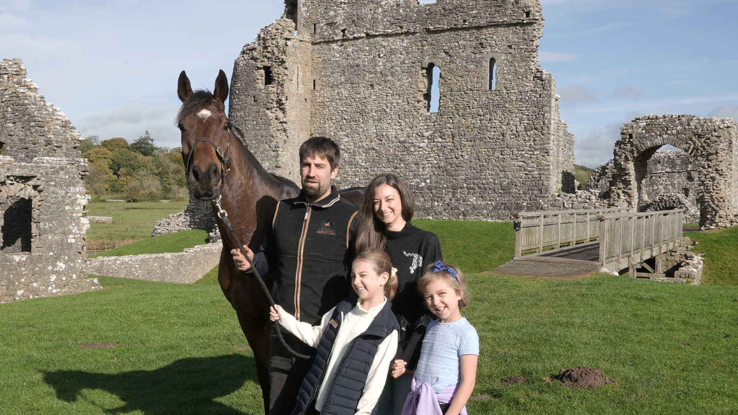 Charlotte, Christian and their daughters Betsy and Tilly with Kitty's Light in the grounds of Ogmore Castle