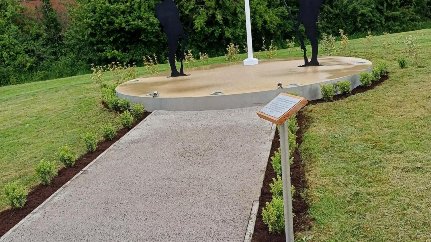 The memorial before the plants had been dug up