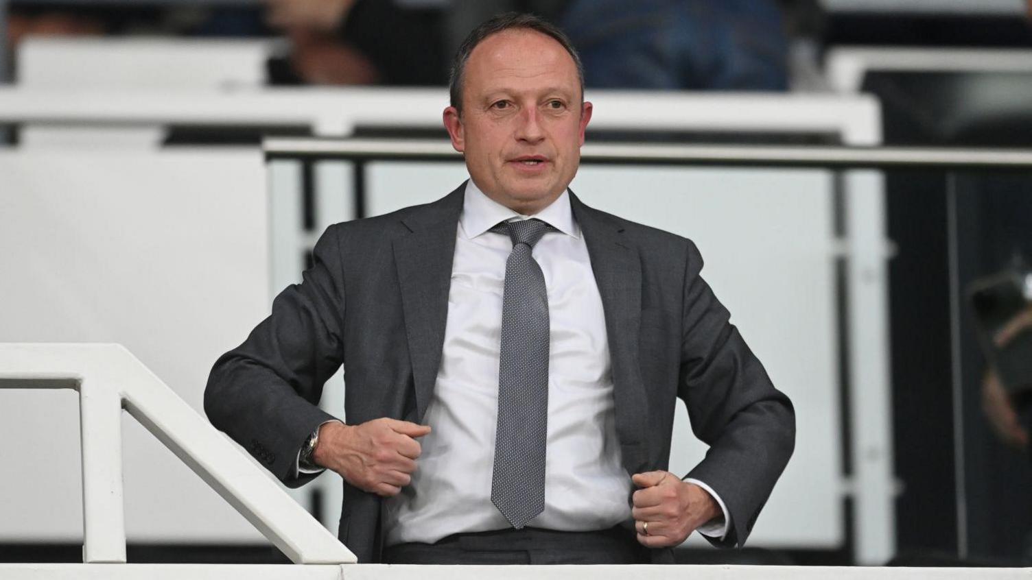 Derby owner David Clowes dressed in a suit, at a Rams match