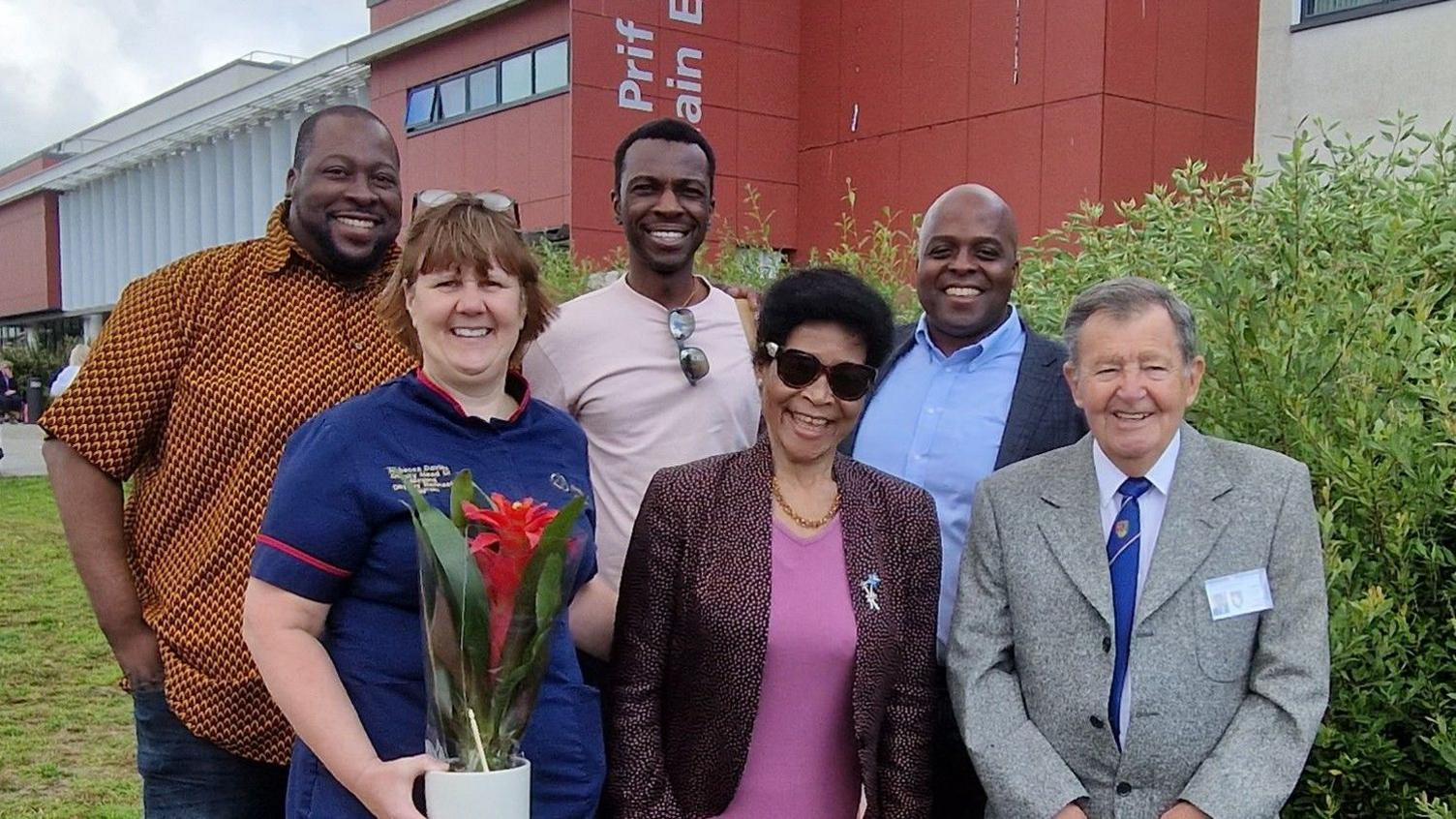 Agnes with her sons Farai, Tendai, and Rugare, and members of staff at the hospital