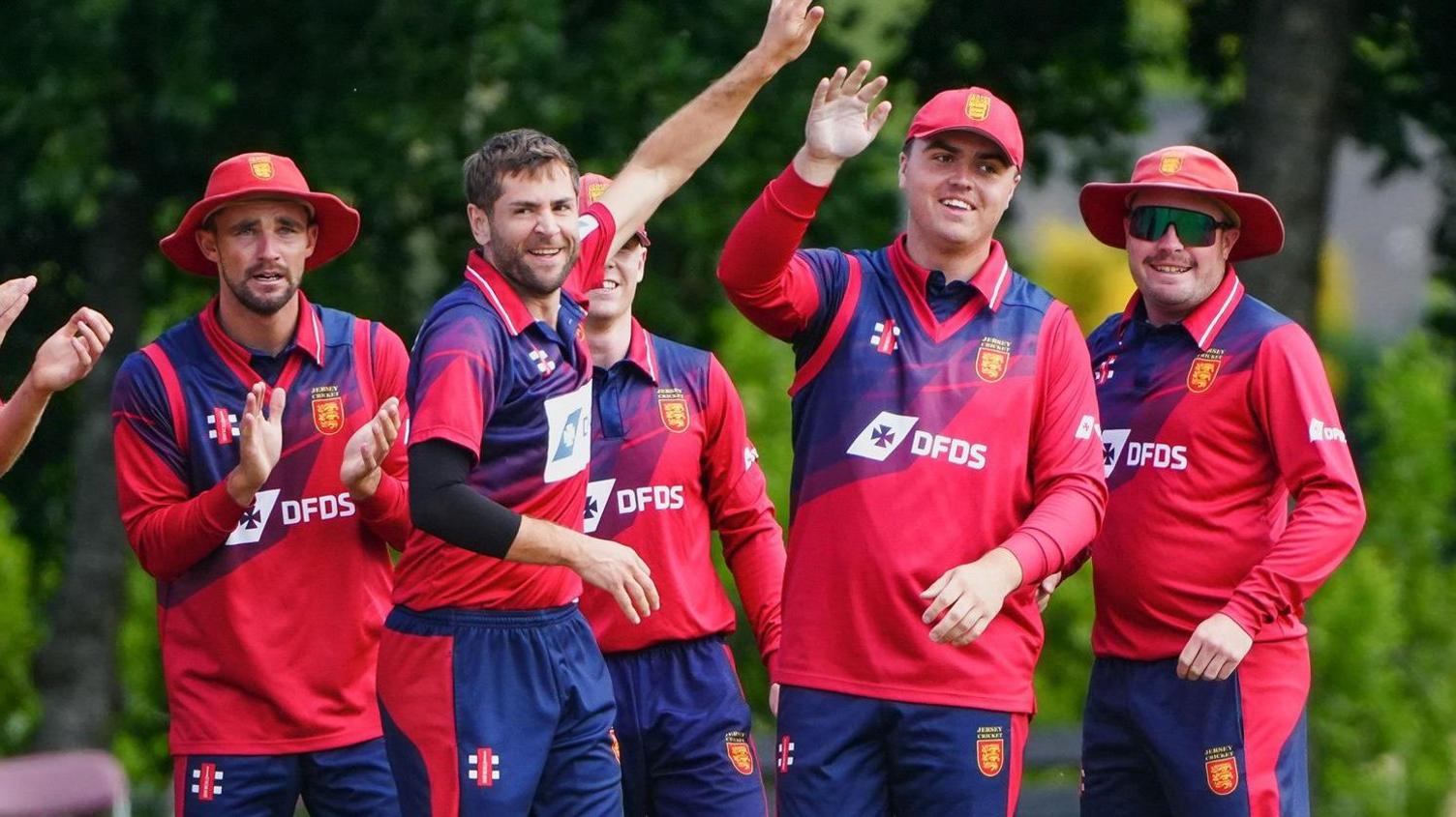 Jersey platers celebrate taking a Scottish wicket