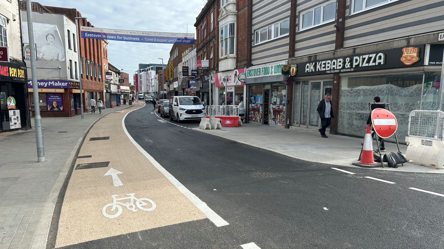 Bridgwater's Celebration Mile with new road markings and a temporary street sign showing the road has new entry rules and a cycle land on the left.