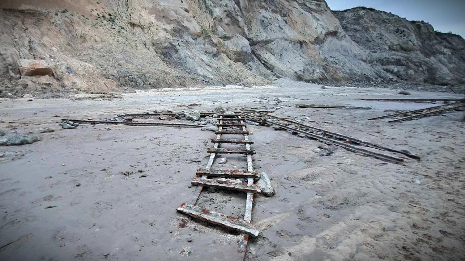 Five sections of railway track on the beach at Trimingham