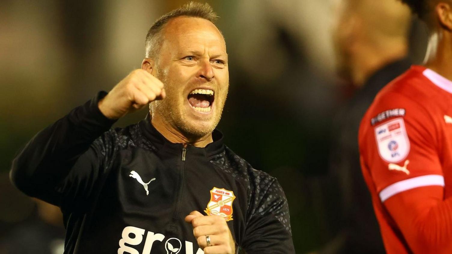 Swindon Town manager Michael Flynn on the touchline during a League Two game.