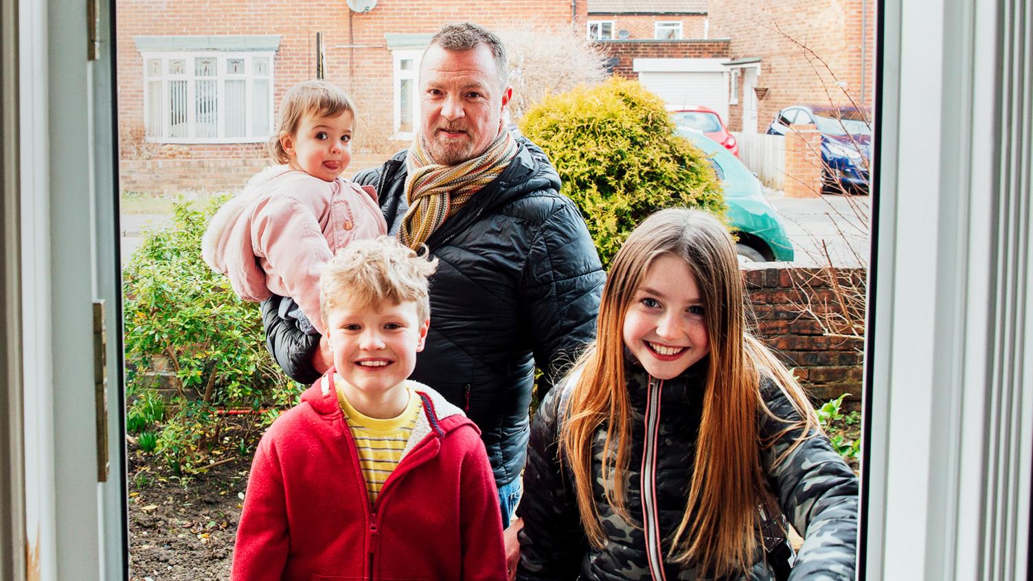 Family at a front door