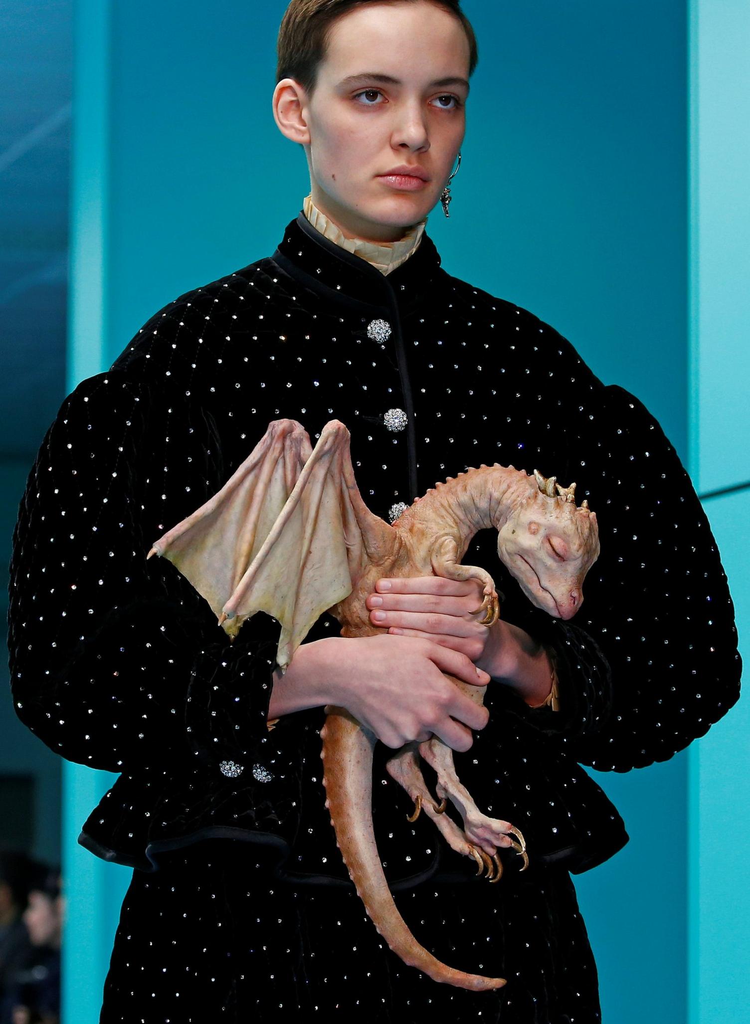 This amazingly realistic model of a baby dragon looks like it slept through its appearance on the fashion catwalk