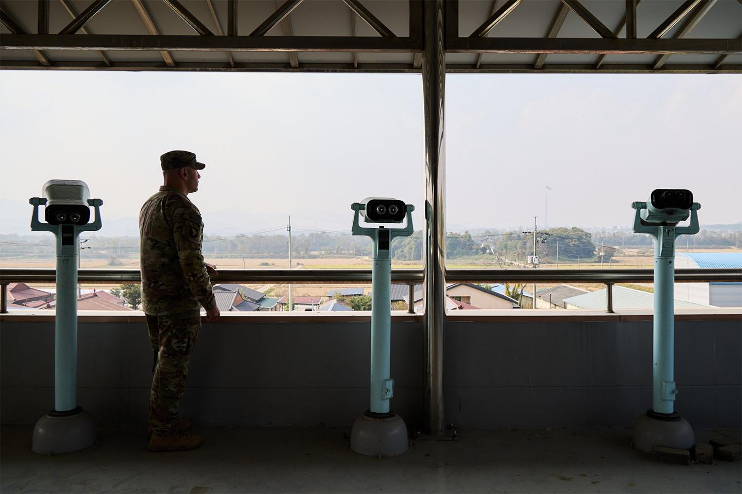 Commander Mercado looking out over the village from the townhall