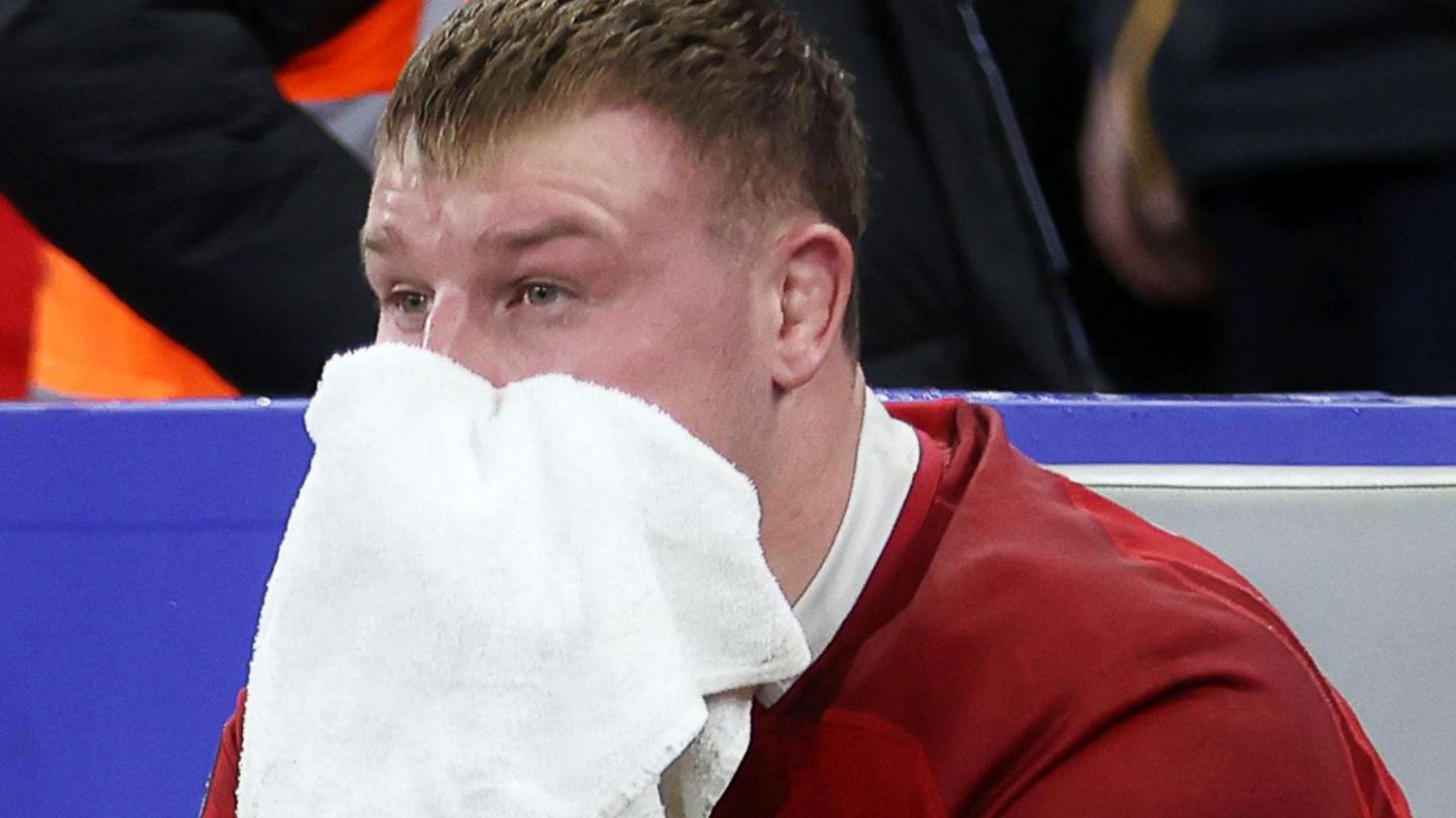 A dejected Dewi Lake wipes his face with a towel