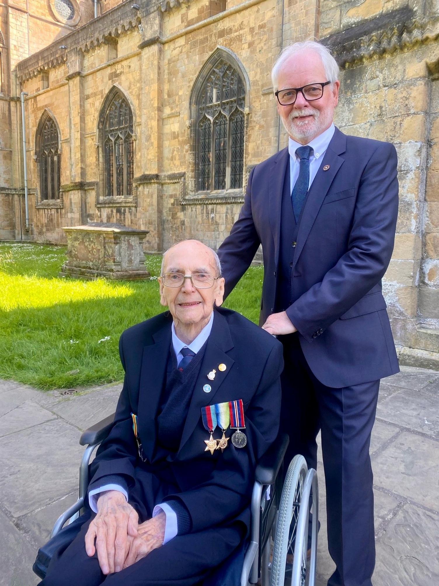 Desmond Burrows in Navy uniform with son Mick at Southwell Minster in June 