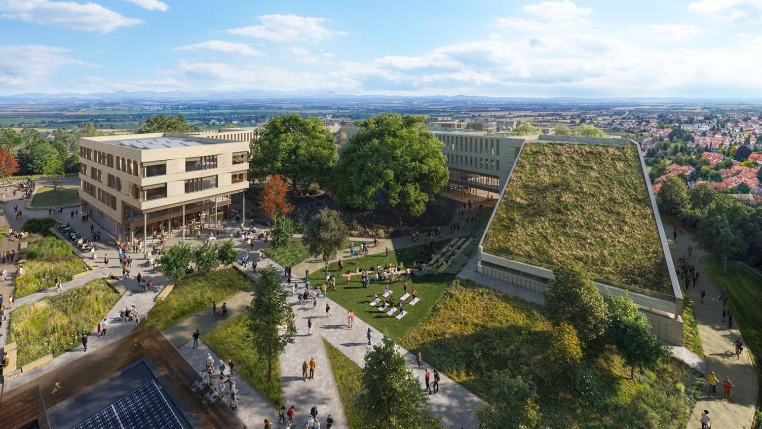 Computer generated image of a section of the Golden Valley development showing buildings with grass growing on the roofs and solar panels.