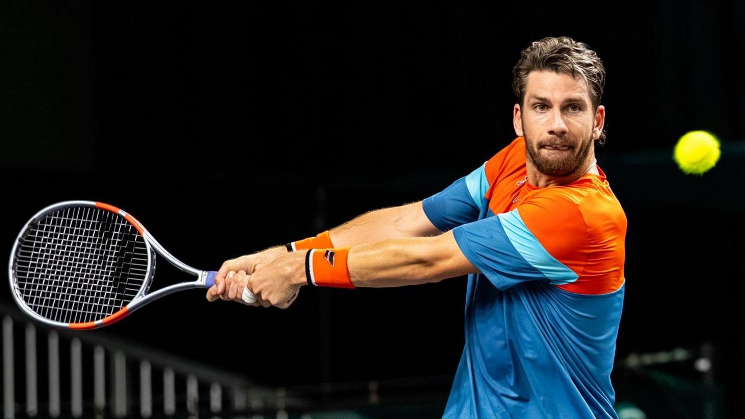 Cameron Norrie prepares to play a backhand