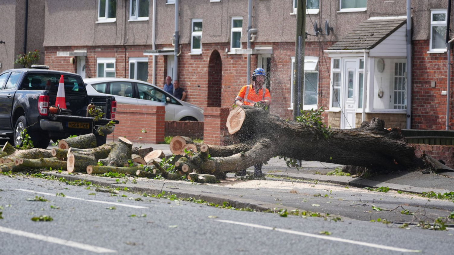 Workers cut up a tree which was felled by the wind on Plessey Road in Blyth, Northumberland.