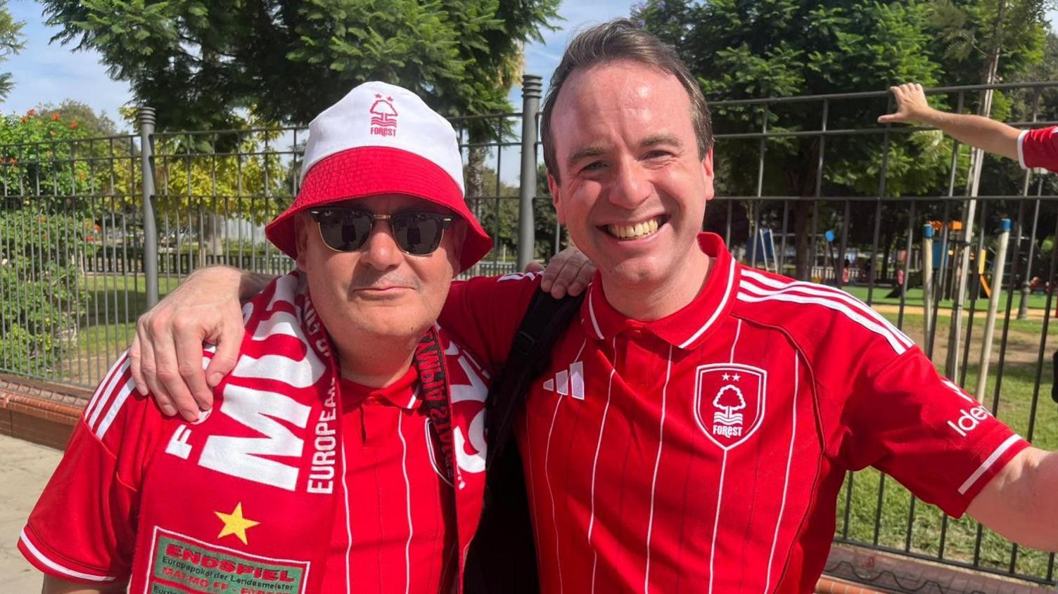 Comedian Matt Forde posing for a photo with a fellow Forest fan in Seville. 