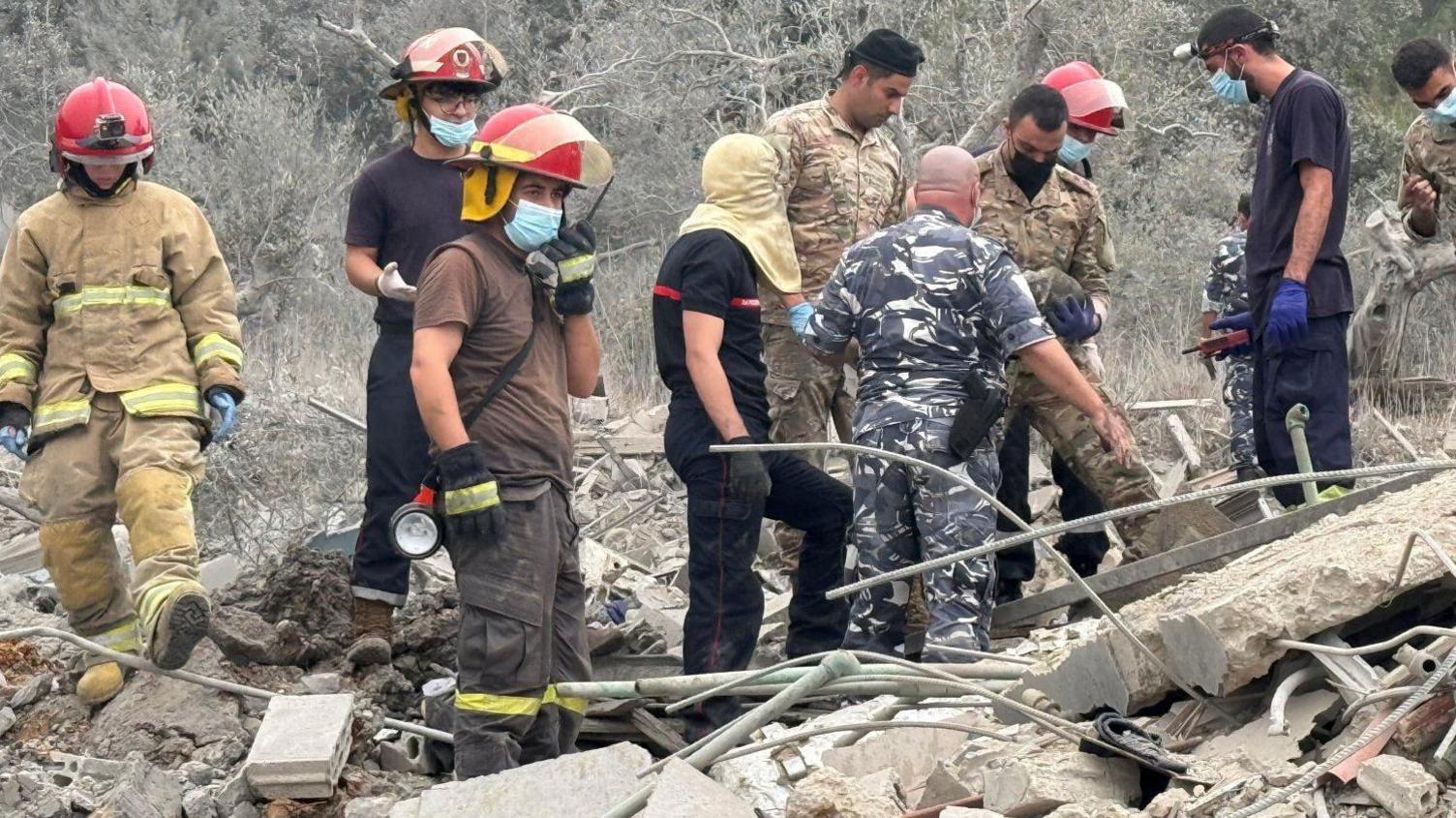 Lebanon's civil defence team examines wreckage after an Israeli air strike in Aitou, northern Lebanon. Photo: 14 October 2024