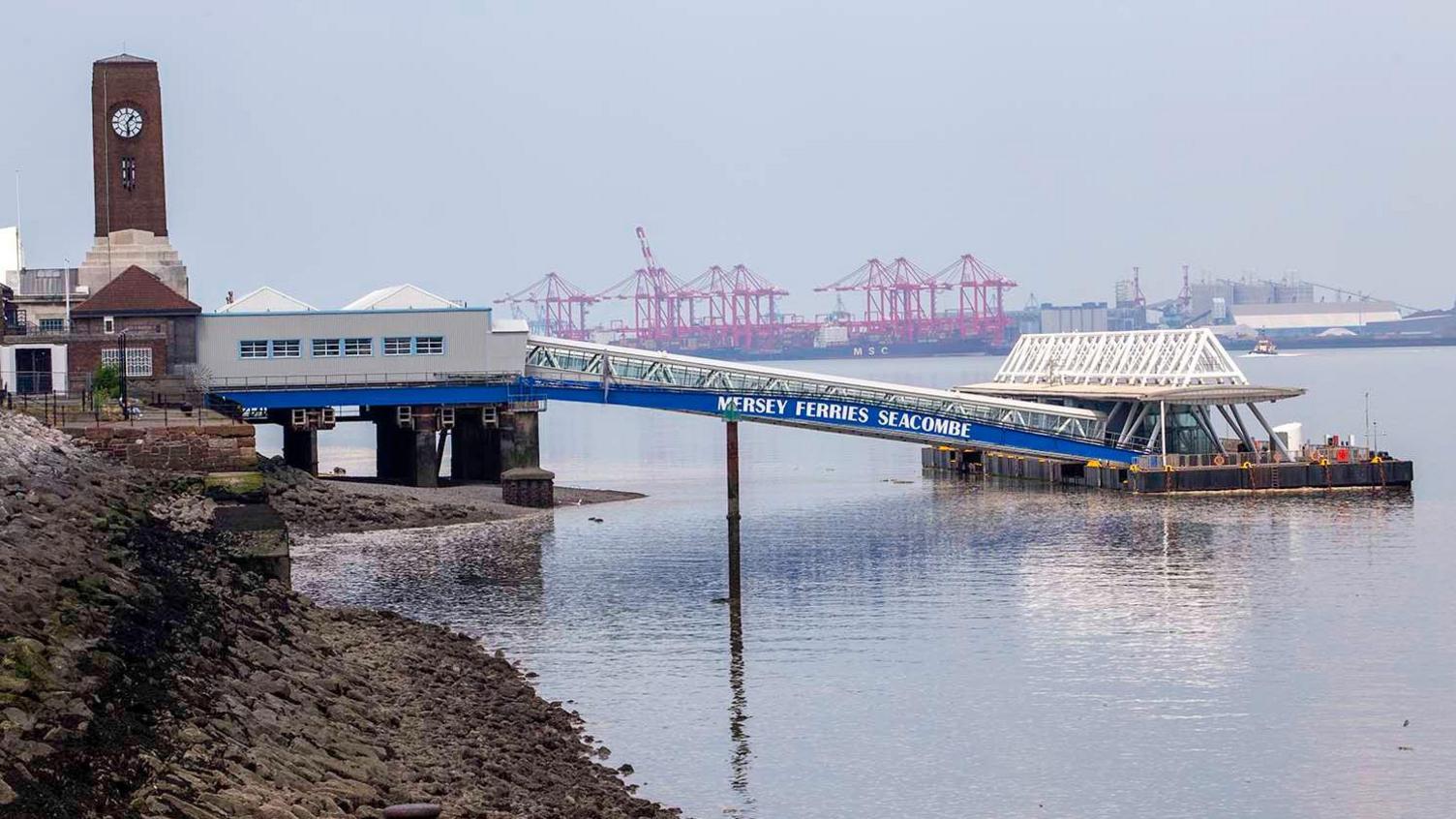 Seacombe Ferry Terminal in Wirral showing the building and the walkway for passengers to wait to embark on the ferry sailings across the River Mersey.  