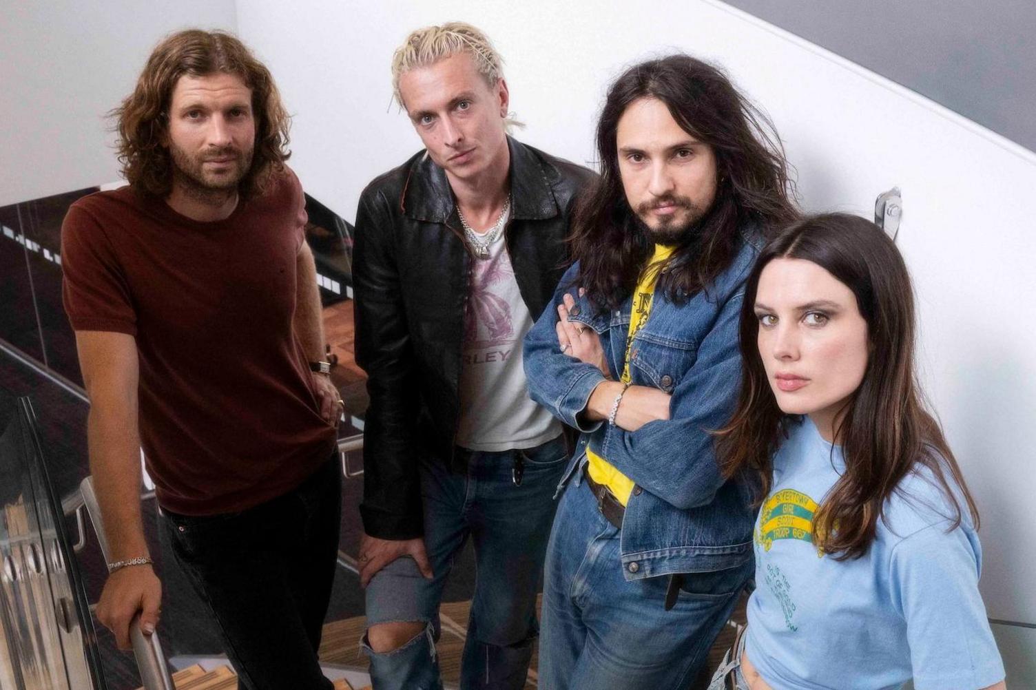 Wolf Alice pose on a staircase at the BBC's New Broadcasting House in August 2025 (L-R): Joff Oddie, Theo Ellis, Joel Amey and Ellie Rowsell