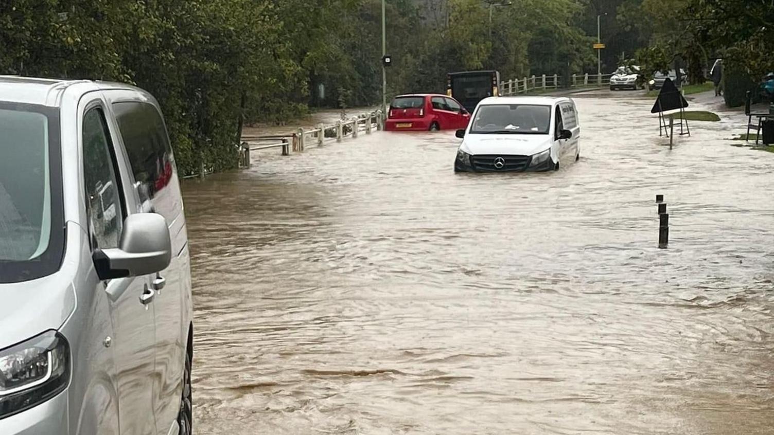 Vehicles stranded in floodwater on Debenham High Street, during Storm Babet in 2023.