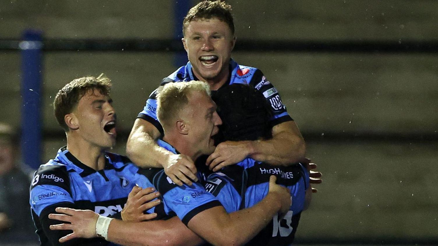 Cardiff celebrate after Evan Lloyd's first try in the win against Lions