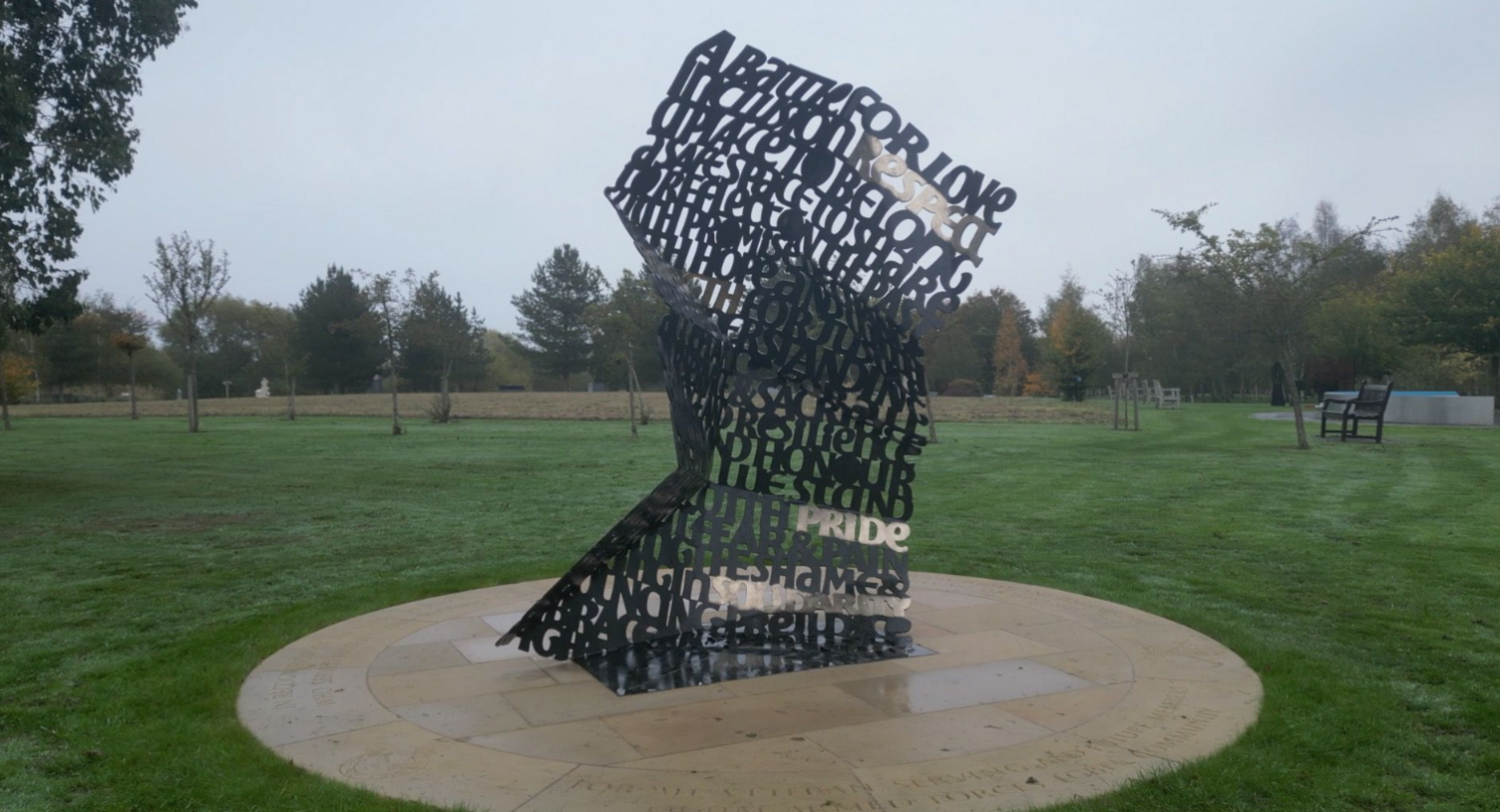 The memorial, which is made of copper, and has words such as 'pride', 'resilience', and 'a battle for love'