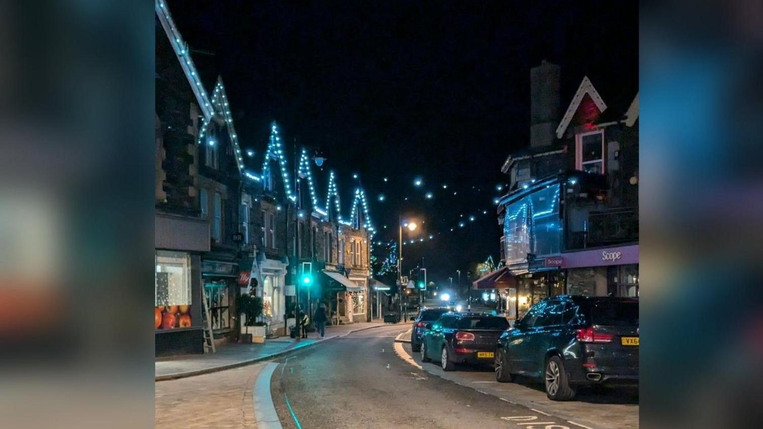 One of the main streets in Windermere with blue Christmas lights twinkling.