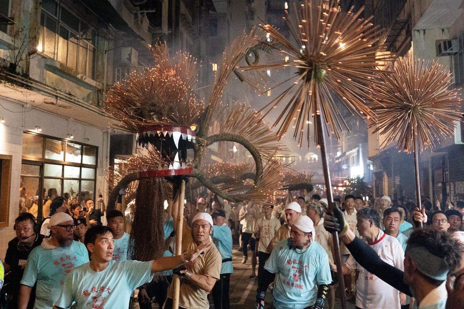 Worshippers carry a bamboo dragon during the Tai Hang fire dragon dance. 